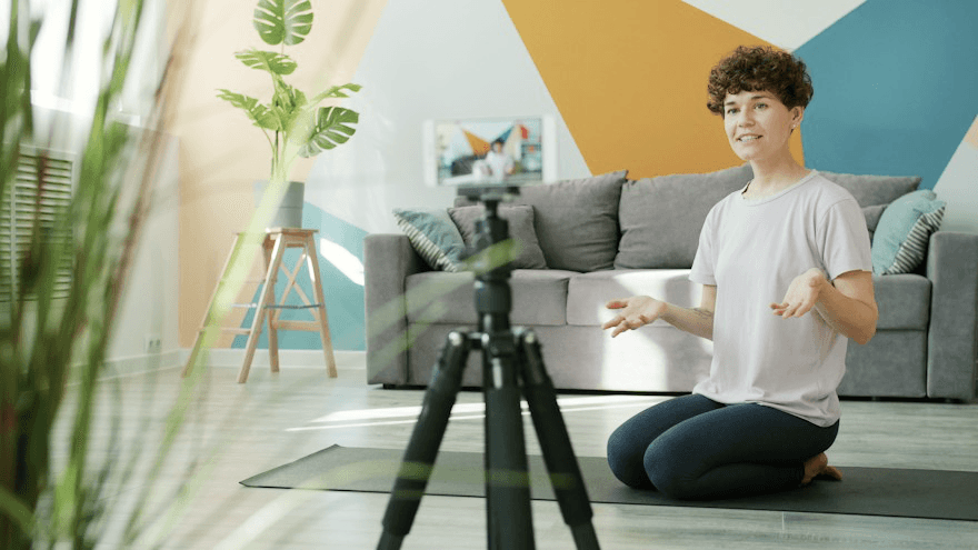 A teacher setting up a camera to record a class from home
